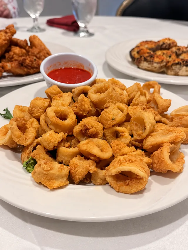 Fried calamari with red dipping sauce at Olive & Oak